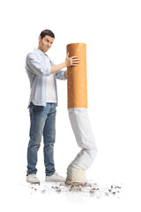 Angry young man putting off a big cigarette
