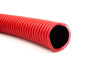 Red plastic corrugated pipe isolated on white background