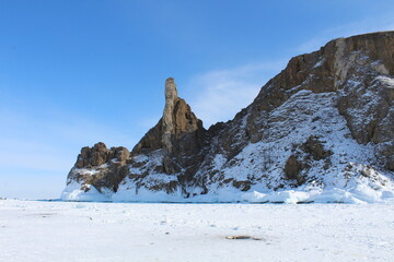 Baikal lake in winter. Ice formations, mountains, snow landscape