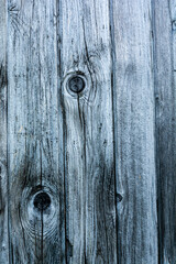 Knots in old boards on the wall. Background.