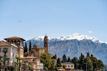 Fototapeta na wymiar Church of San Lorenzo in the background of the town of Tremezzo. Como, Italy