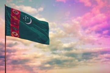 Fluttering Turkmenistan flag mockup with the space for your content on colorful cloudy sky...