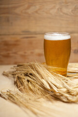 Glass of beer with barley