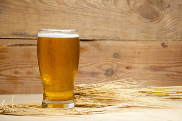 Glass of beer with barley