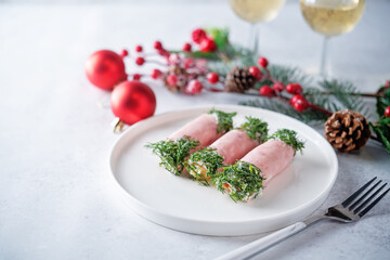 Ham cheese garlic rolls decorated with dill and cream sauce