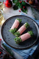 Ham cheese garlic rolls decorated with dill and cream sauce