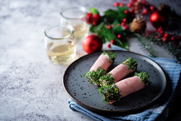 Ham cheese garlic rolls decorated with dill and cream sauce
