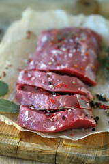 Fresh raw veal in paper. Farmed organic meat.