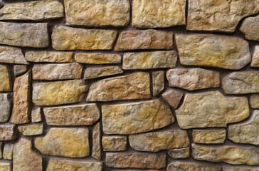 The texture of a stone wall lined with cobblestones.