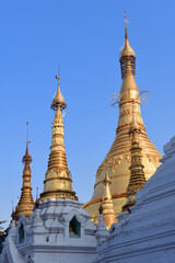 Fototapeta premium detail view to a group of golden stupas at the Shwedagon Pagoda in Yangoon, Myanmar (Burma) 