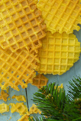 Viennese waffles on a wooden background. Dessert for breakfast. New Year's composition. Top view.