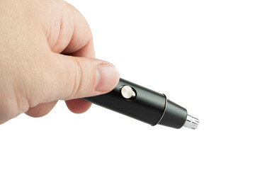 Fototapeta premium Hand holding a black nose trimmer