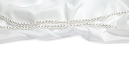 Beautiful pearls and delicate silk on white background