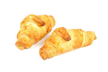 Delicious, crunchy croissant with filling on an isolated white background. Copy space Breakfast bakery product.