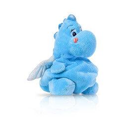 Plush dragon doll isolated on a white background with shadow reflection. A plush dinosaur toy. A soft blue dinosaur toy.