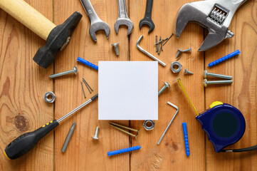 Advertising of construction services. White square sheet and a lot of building tools.