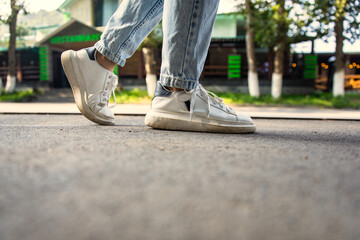 close-up of sneakers shoes walking on the way