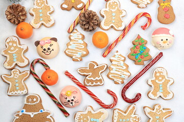 Christmas new year food, traditional gingerbread and homemade cookies with fir branches, pine cones and decorations, dish design idea, bakery concept, festive background or postcard