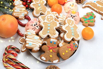 Christmas new year food, traditional gingerbread and homemade cookies with fir branches, pine cones and decorations, dish design idea, bakery concept, festive background or postcard,