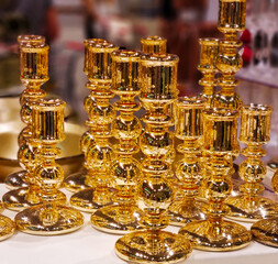 A beautiful candlestick of extraordinary design made of thin glass covered with a layer of gilding