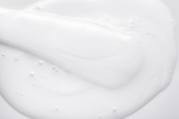 White cosmetic lotion, cream, textured background