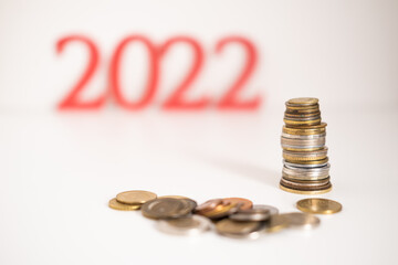 2022 New year saving money and financial growth concept. Creative idea for business growth, tax...