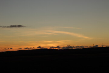 early morning dawn in the steppe over the hills