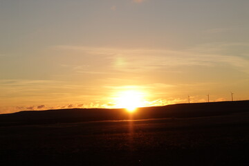 Fototapeta premium morning dawn in the steppe over the hills
