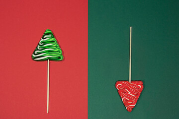 Lollipop sweet candies fir tree shaped on red green background, Christmas color background with...