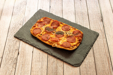 Pepperoni is an American variety of salami, made from cured pork and beef mixed and seasoned with...