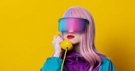 Style woman in VR glasses and 90s sport suit with dial phone