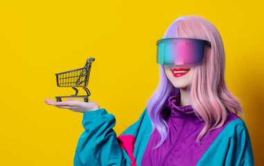 Style woman in VR glasses and 90s sport suit with shopping cart