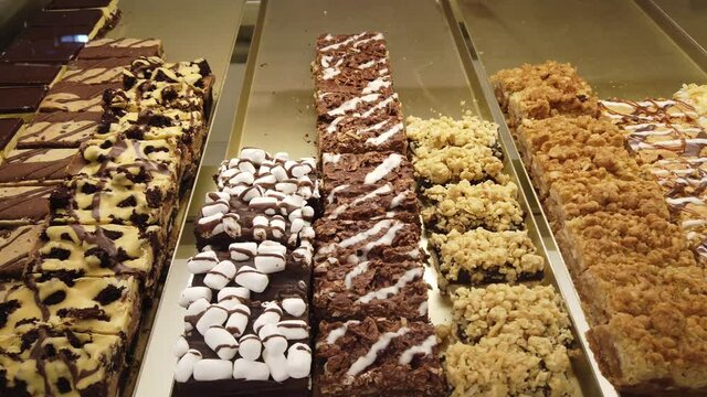 Bakers Shop Delicious Pastries Desserts Rumballs With Caramel And Chocolate Brownies Left To Right Close Pan
