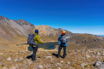 Couple Trekking on the natural landscape. Hiking man and woman