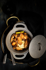 Elegant two-handle casserole full of delicious chicken roast wings.