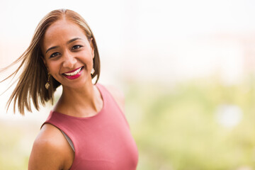 Millennial Indian mixed race woman with fashionable hairstyle. 