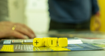 Role-playing instructions with four yellow six sided dices on top