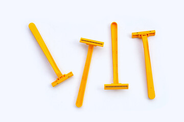 Orange shaving razor isolated on white background