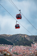 A view of two cable cars gondolas which are a part of the Teleferico system in La Paz Bolivia in...
