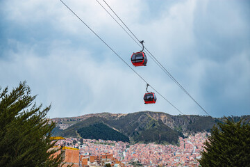 A view of two cable cars gondolas which are a part of the Teleferico system in La Paz Bolivia in South America