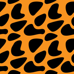 Animal skin pattern. Black spots on orange background. Leopard skin. For textile and paper design