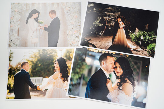 printed on paper photos of the bride and groom.