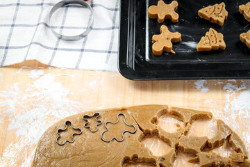 Homemade Christmas cookies, preparing gingerbread cookies dough, cutting dough by cookie mold, food homemade bakery concept