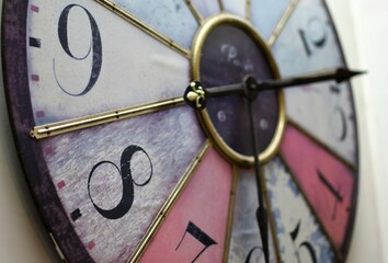 Close up of an old clock with moving pointers. Concept of time, the past or deadline