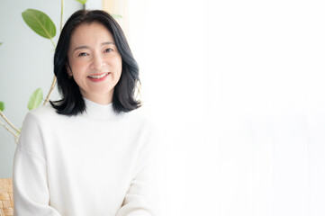 portrait of a person Asian beautiful  (Japanese) woman relaxing looking at camera