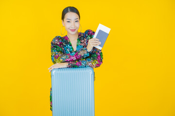 Portrait beautiful young asian woman with luggage bag and passport