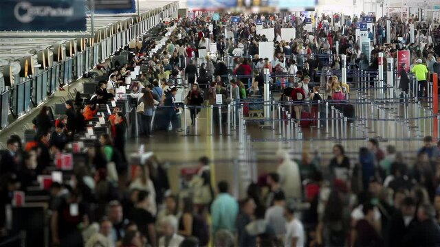 Travellers at Departure Lounge after the Covid Pandemic , Santiago International Airport, Santiago, Chile. Timelapse. High Angle View. Zoom In. 4K Resolution.