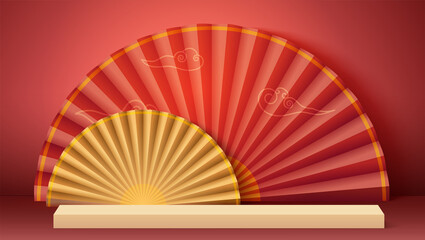 Red background in origami style. Paper fans and yellow clouds in Asian style. Studio for cosmetic product display.