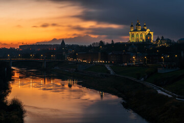 Fototapeta premium View of the embankment of the Dnieper River in Smolensk, the Assumption Cathedral and the wall of the Smolensk Fortress in the night illumination, Smolensk, Russia