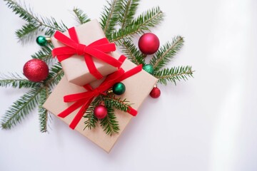 Christmas background with gift boxes and ornaments in white color. Xmas celebration, greetings, preparation for winter holidays. Festive mockup, top view, flat lay with copy space.